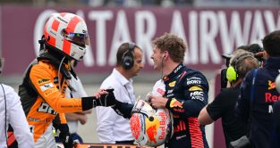 Lando Norris and Max Verstappen shake hands after qualifying. Spain June 2023