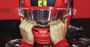 Charles Leclerc with his hands to his visor. Ferrari Canada June 2023