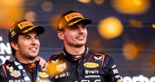 Red Bull drivers Sergio Perez and Max Verstappen pose on the podium after a one-two finish in Azerbaijan. Baku, April 2023.