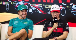 Fernando Alonso sits with Zhou Guanyu.