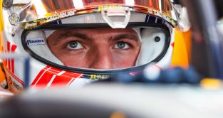 红牛车队的司机and reigning F1 World Champion Max Verstappen looks on from the garage during qualifying for the Austrian Grand Prix. Styria, June 2023.