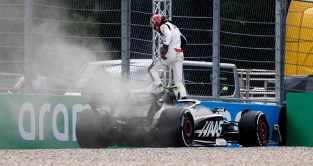 Nico Hulkenberg steps out of broken down Haas. Austria, July 2023.