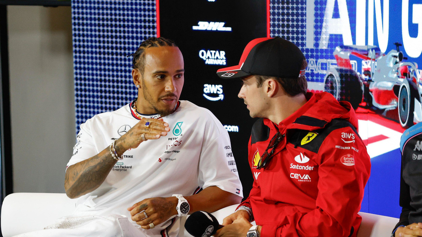 Lewis Hamilton chatting to Charles Leclerc at a press conference. Britain July 2023