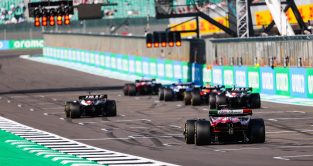 Cars line up on F1 starting grid for practice starts