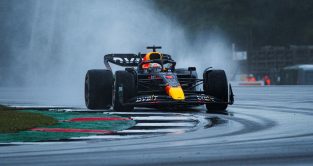 Max Verstappen (Red Bull) round a corner in the wet in final practice at the British Grand Prix. Silverstone, July 2023.