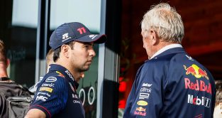 Sergio Perez in serious conversation with Helmut Marko. Britain July 2023