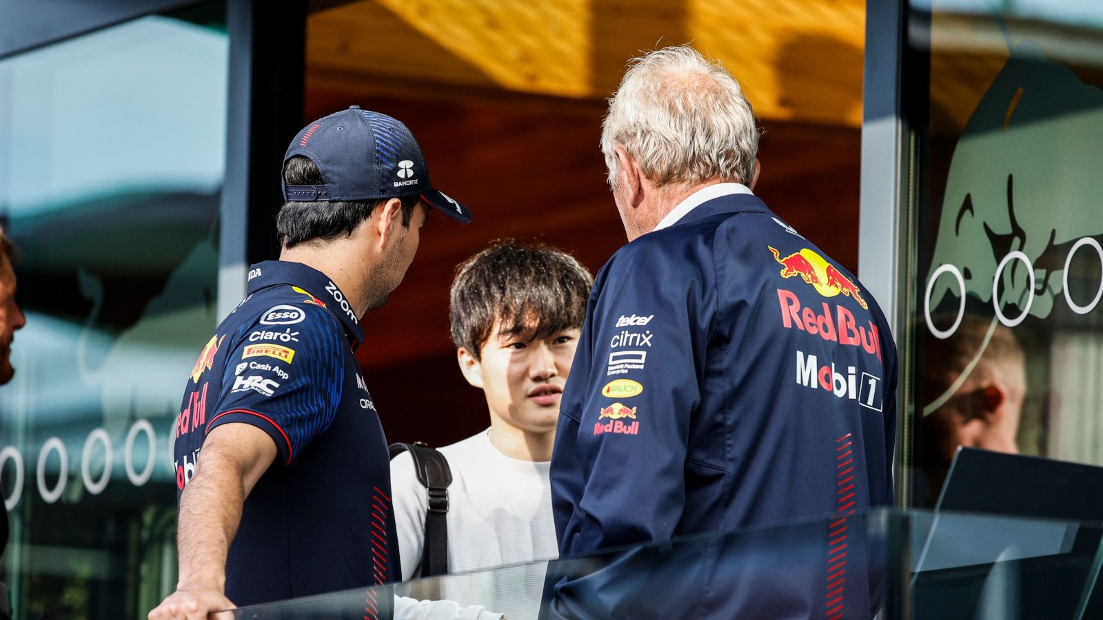 Helmut Marko speaking with Yuki Tsunoda and Sergio Perez. Britain July 2023