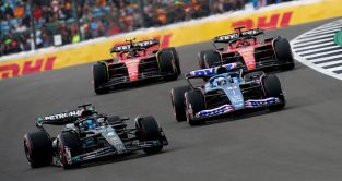 Mercedes' George Russell and Alpine's Esteban Ocon are followed by the Ferrari's of Carlos Sainz and Charles Leclerc . Britain July 2023