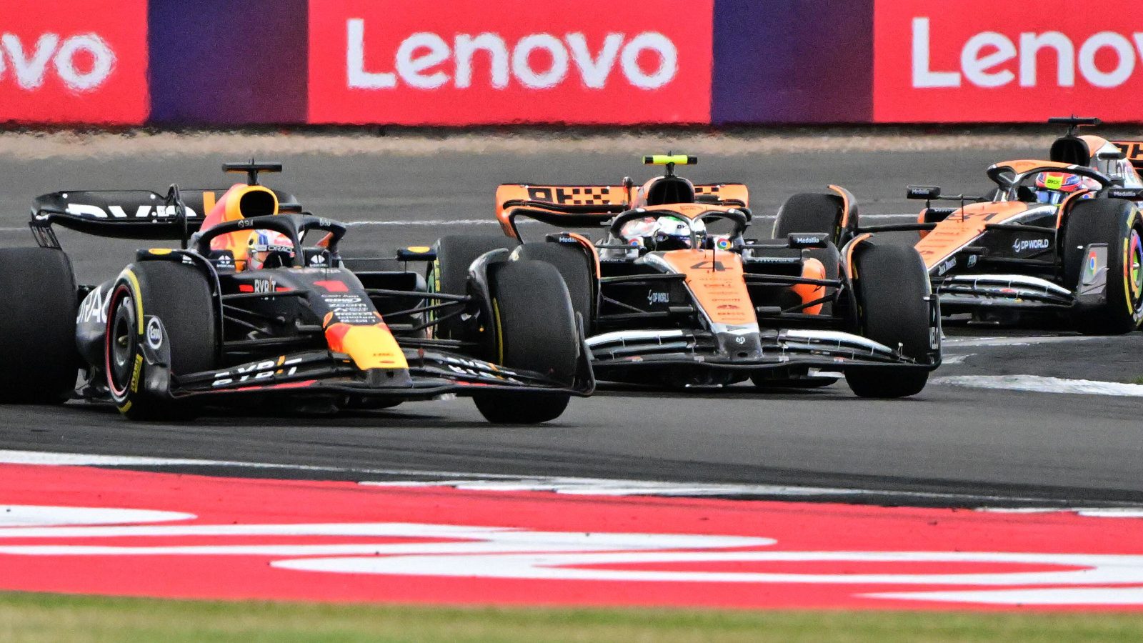 Max Verstappen leads the McLaren MCL60s at Silverstone. Britain July 2023