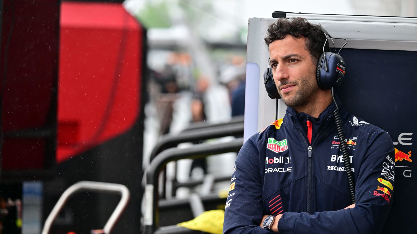 达尼el Ricciardo pensive with arms crossed. Britain July 2023