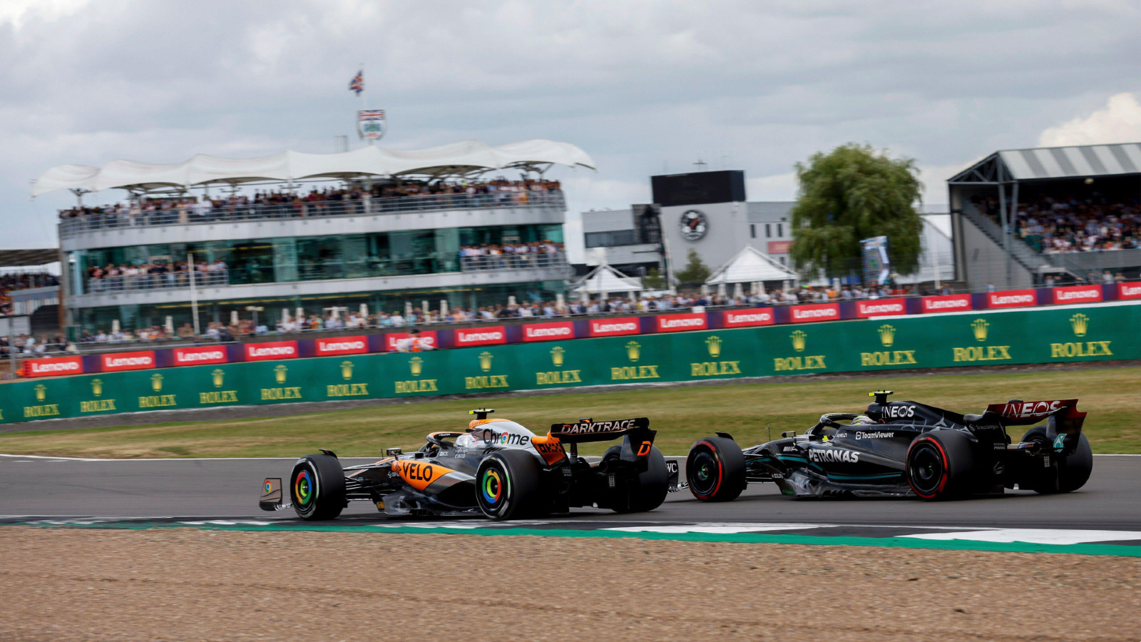 McLaren's Lando Norris races Mercedes' Lewis Hamilton at the British Grand Prix. Silverstone, July 2023.