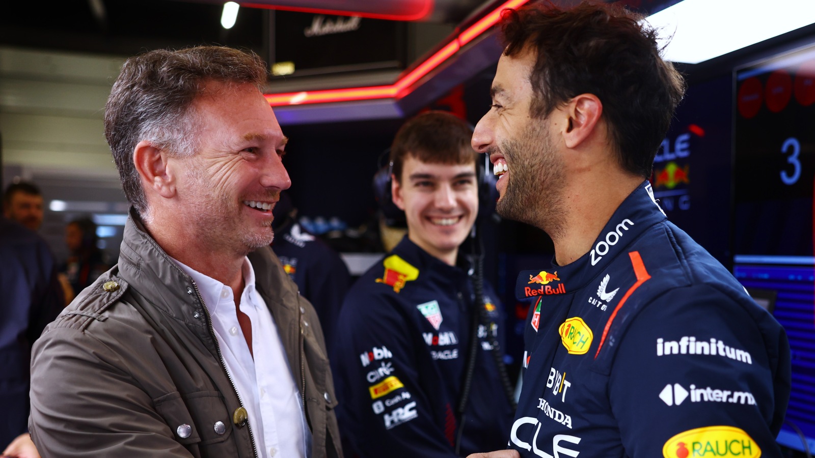 Christian Horner and Daniel Ricciardo smiling. Silverstone, July 2023.