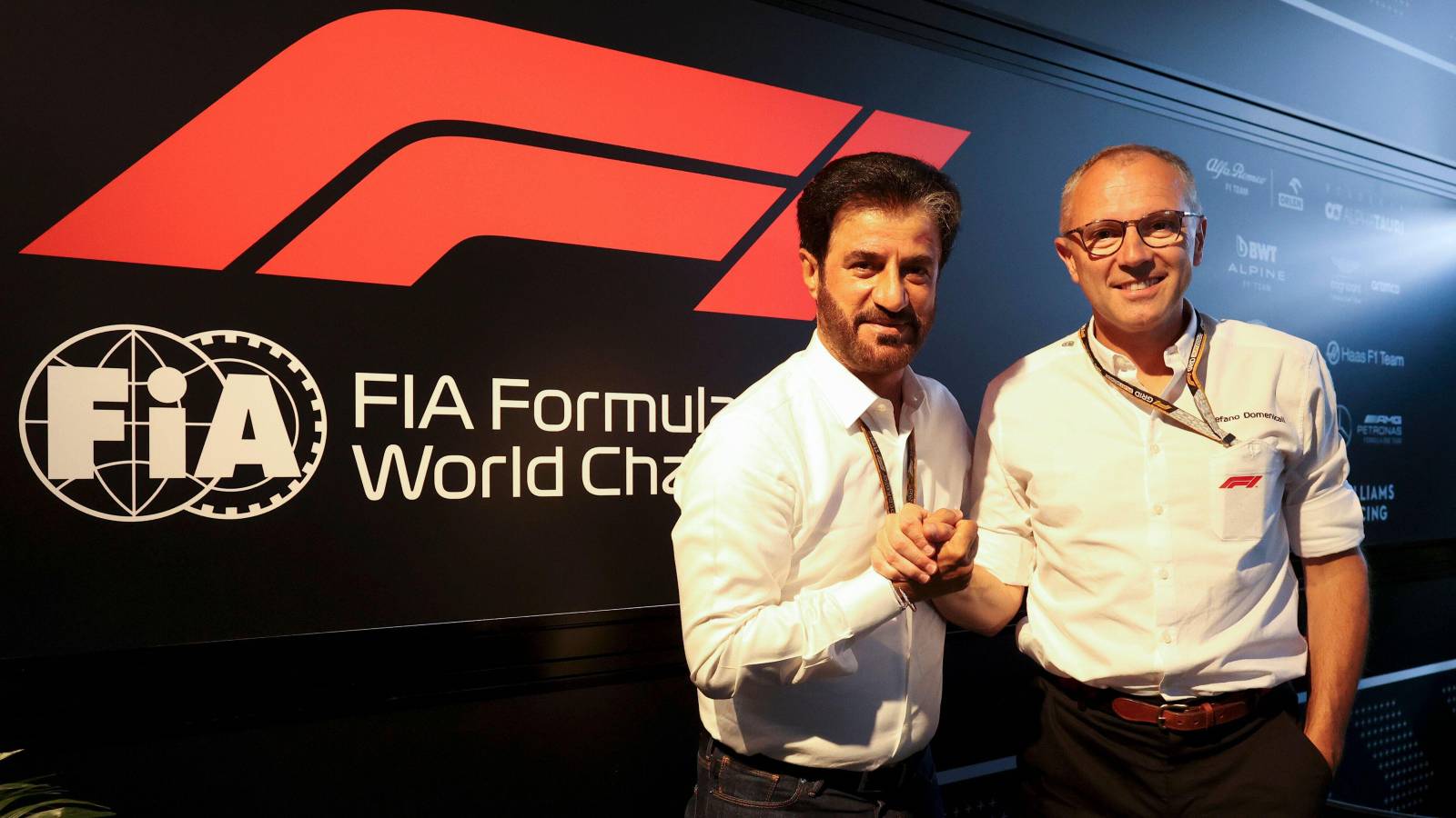 Mohammed Ben Sulayem and Stefano Domenicali shake hands. Hungary, July 2022.