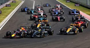 Red Bull's Max Verstappen takes the lead at the start of the Hungarian Grand Prix. Budapest, July 2023.