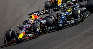 Max Verstappen overtakes Lewis Hamilton. Hungary July 2023
