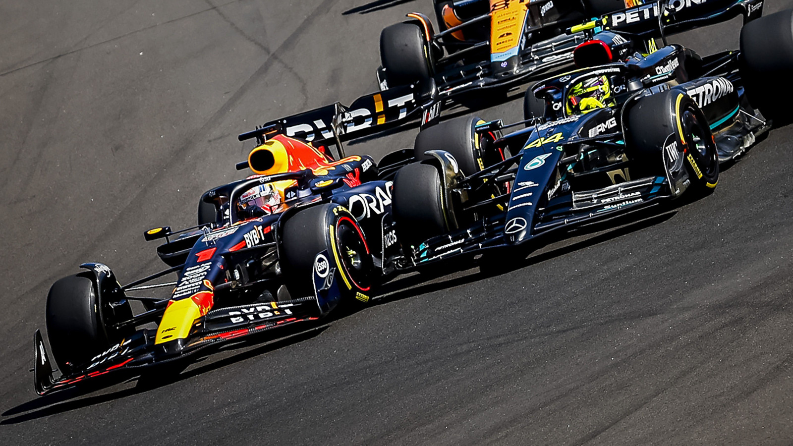 Max Verstappen overtakes Lewis Hamilton. Hungary July 2023
