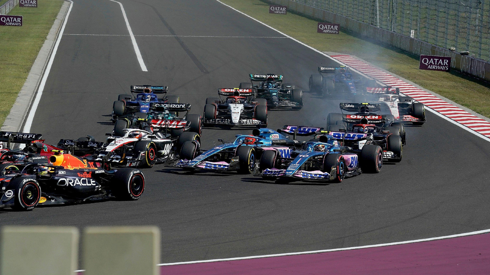 Alpine's Esteban Ocon and Pierre Gasly make contact in the Hungarian Grand Prix. Budapest, July 2023.
