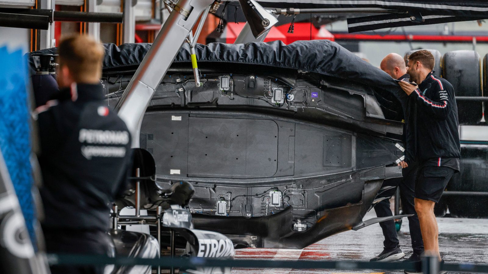 Mercedes' revised floor at Spa being carried in by the mechanics. Belgium July 2023