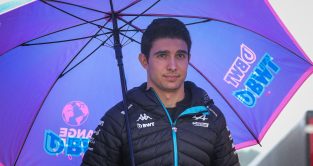 Esteban Ocon under an umbrella. Spa, Belgium. July 2023