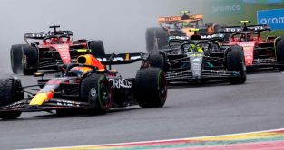 Sergio Perez leads Lewis Hamilton at Les Combes. Belgium July 2023. F1