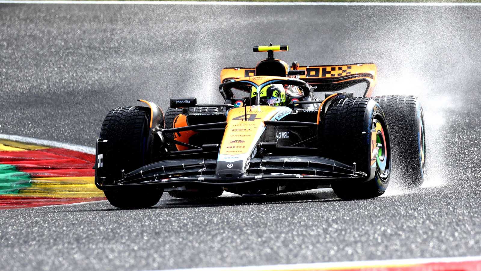 Lando Norris drives in the wet. Spa July 2023.