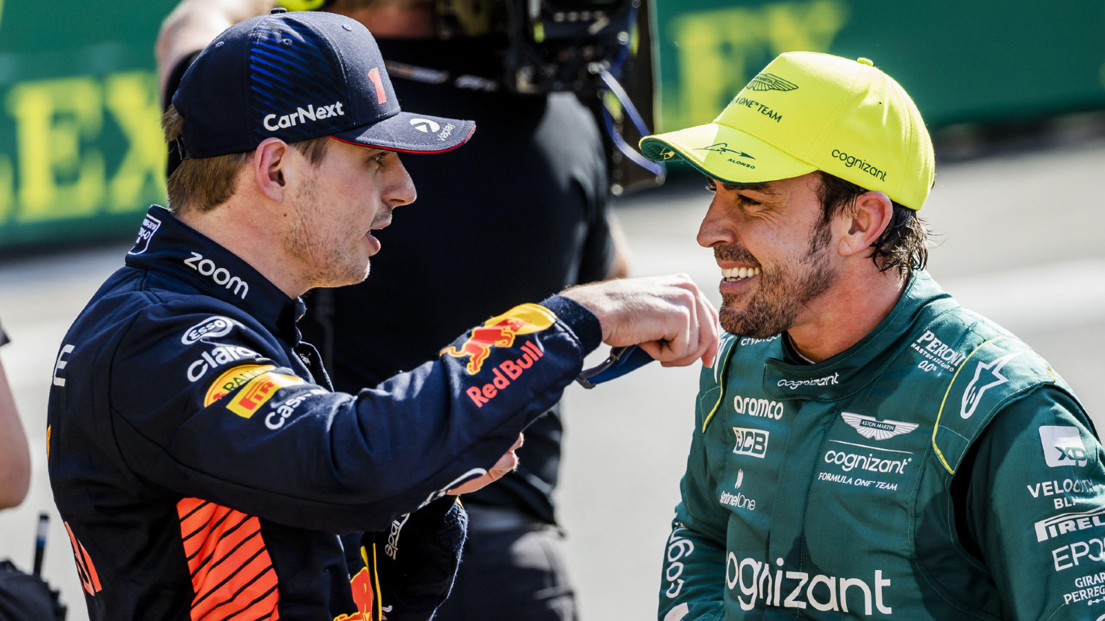 Aston Martin's Fernando Alonso with Red Bull's Max Verstappen