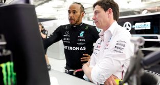 Mercedes' Lewis Hamilton speaking with Toto Wolff.