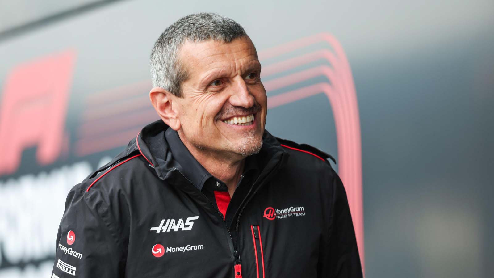 Haas team boss Guenther Steiner smiles.