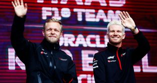 Haas' Kevin Magnussen and Nico Hülkenberg wave
