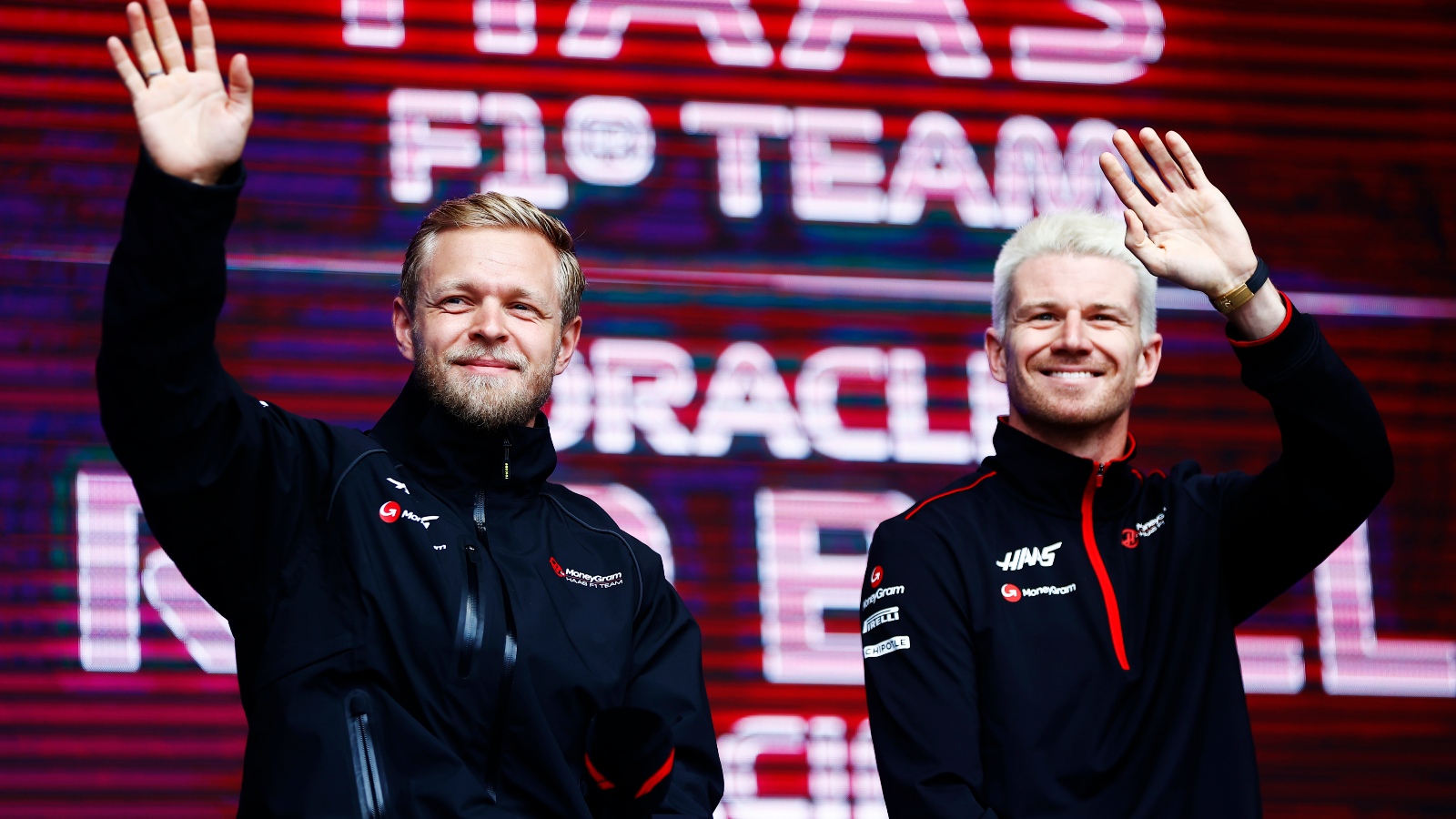 Haas' Kevin Magnussen and Nico Hülkenberg wave