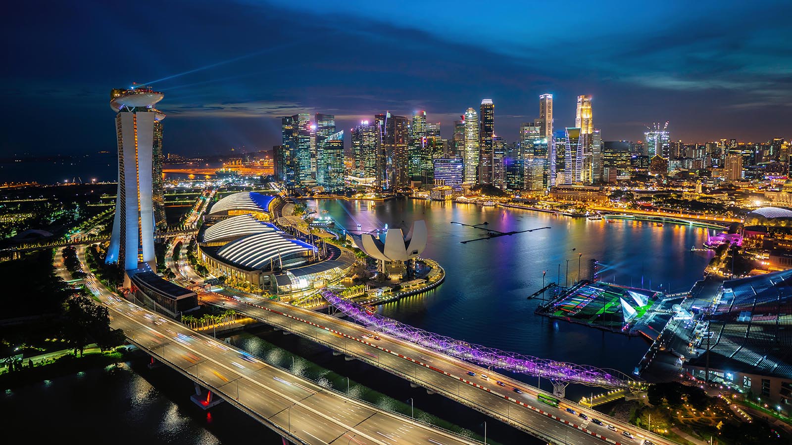 Aerial shot of the Marina Bay in Singapore at blue hour