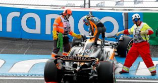 Oscar Piastri climbs from his McLaren after crashing in practice for the Dutch Grand Prix at Turn 3.