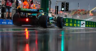 Aston Martin's Fernando Alonso's car in the wet.