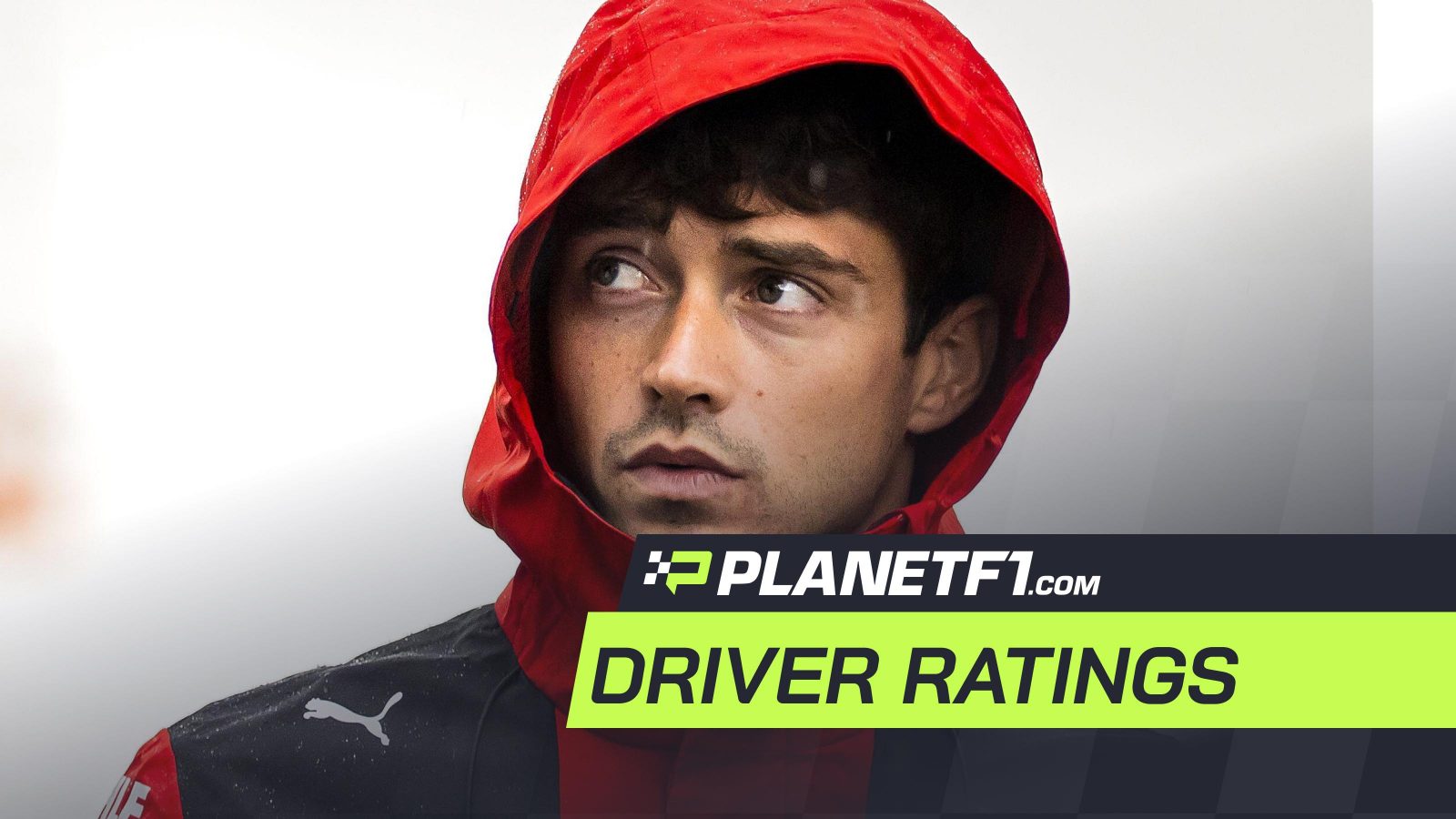 Charles Leclerc walks through the rain at the Dutch Grand Prix weekend