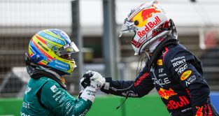 Aston Martin driver Fernando Alonso congratulates Max Verstappen after the Red Bull star's record-equalling Dutch Grand Prix win.