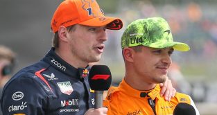 Max Verstappen places his hand on Lando Norris' shoulder during an F1 interview.