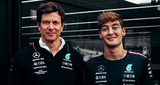 George Russell smiles with Mercedes team boss Toto Wolff after agreeing an extension to his Mercedes contract.