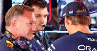 Max Verstappen and Christian Horner chat in the Red Bull garage at Monza.