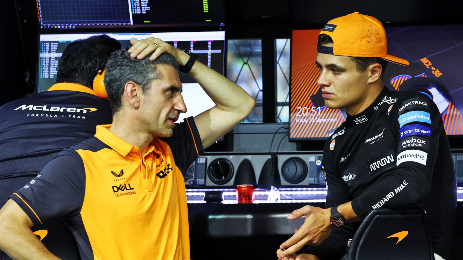 McLaren team boss Lando Norris speaking with Andrea Stella on the McLaren pit gantry.