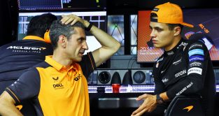 McLaren team boss Lando Norris speaking with Andrea Stella on the McLaren pit gantry.