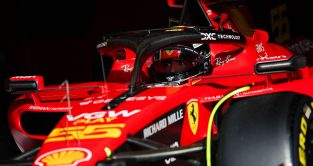 Carlos Sainz up close in the Ferrari with its special Monza livery.