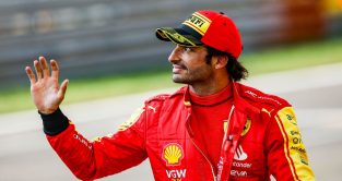 Ferrari driver Carlos Sainz waves to the crowd after setting pole position for the Italian Grand Prix at Monza.
