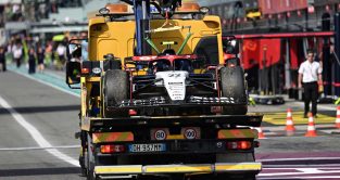 The AlphaTauri of Yuki Tsunoda on the back of a truck at the Italian Grand Prix.