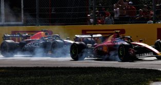 Carlos Sainz, Ferrari, battles Max Verstappen, Red Bull. Italy, September 2023.