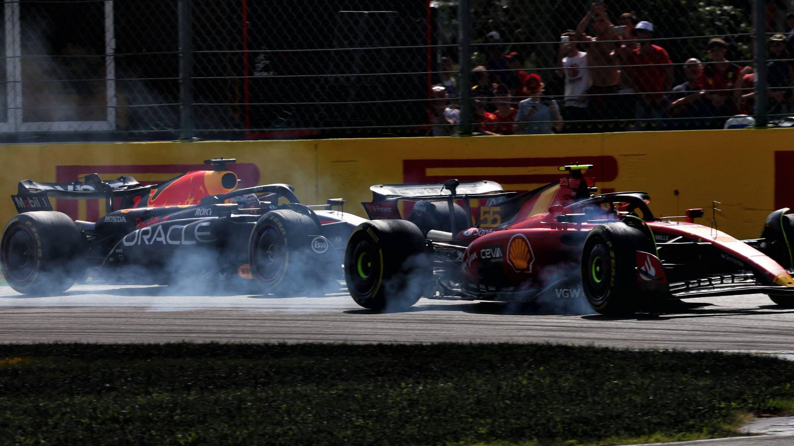 Carlos Sainz, Ferrari, battles Max Verstappen, Red Bull. Italy, September 2023.