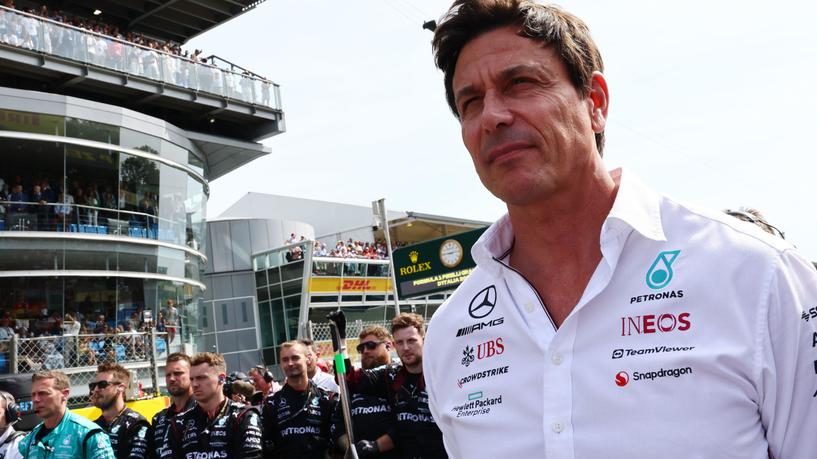 Toto Wolff standing for the national anthem of Italy with the Mercedes team.
