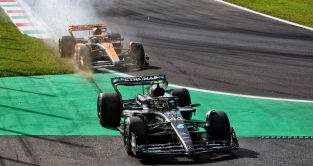 Mercedes Lewis Hamilton off the track at the Roggia chicane after clipping the McLaren of Oscar Piastri.