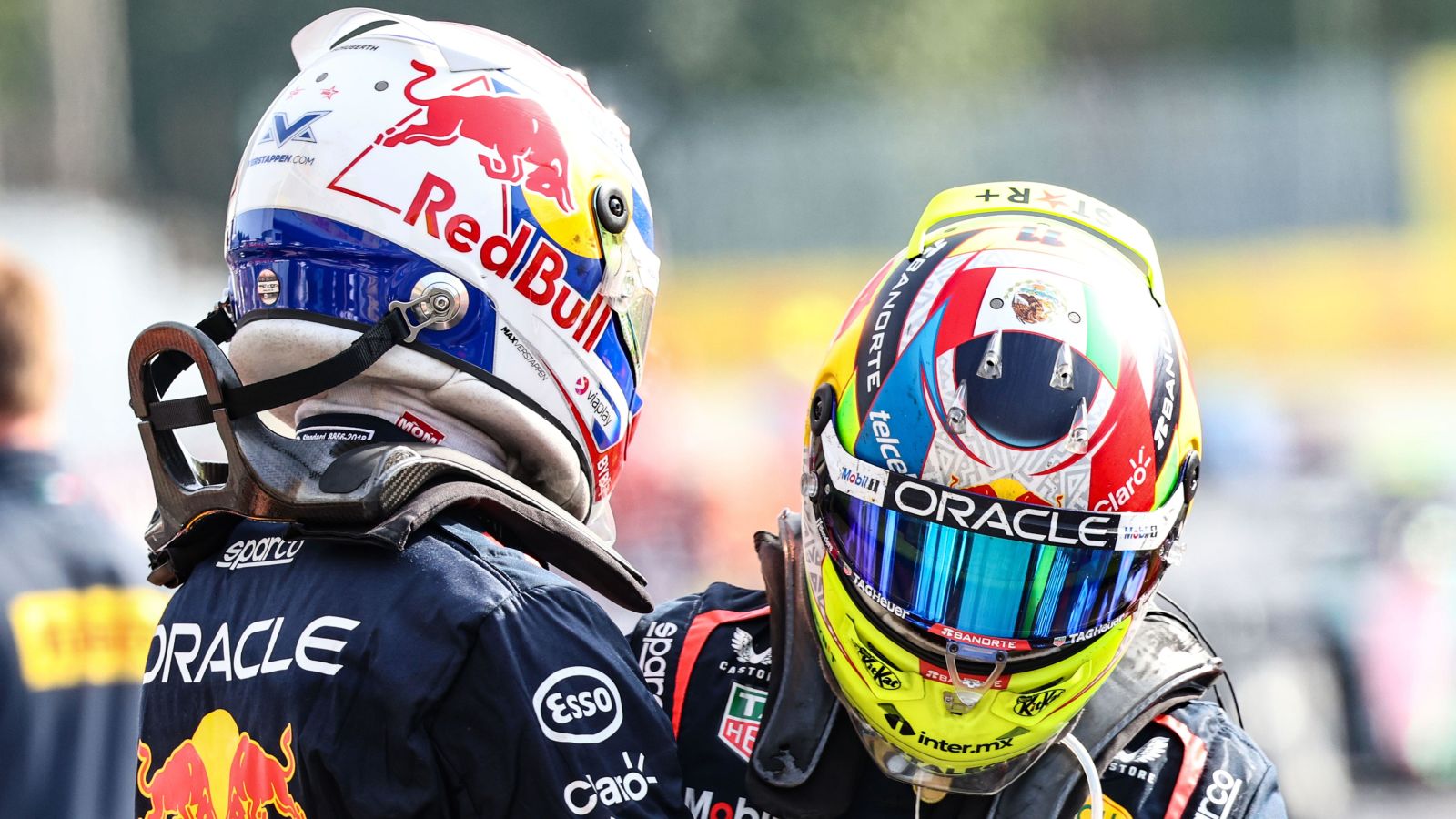 Max Verstappen and Sergio Perez embrace after securing a Red Bull one-two finish at the Italian Grand Prix at Monza.