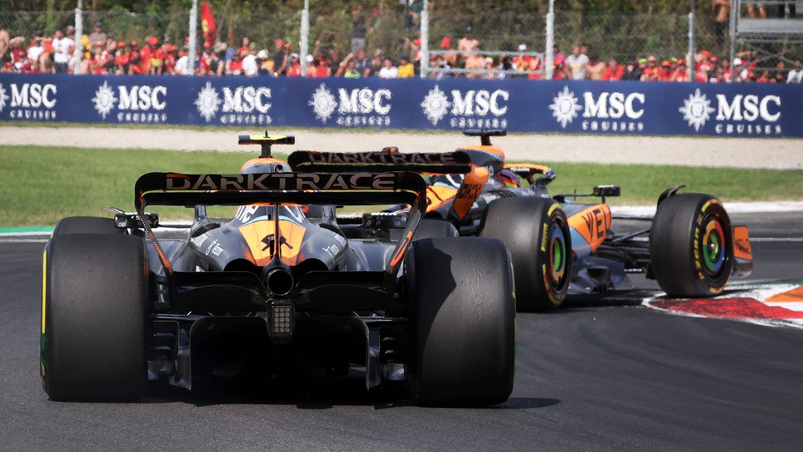 McLaren teammates Lando Norris and Oscar Piastri racing for position at the Italian Grand Prix.