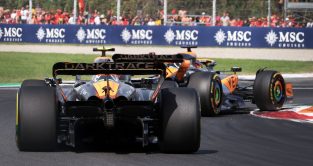 McLaren teammates Lando Norris and Oscar Piastri racing for position at the Italian Grand Prix.